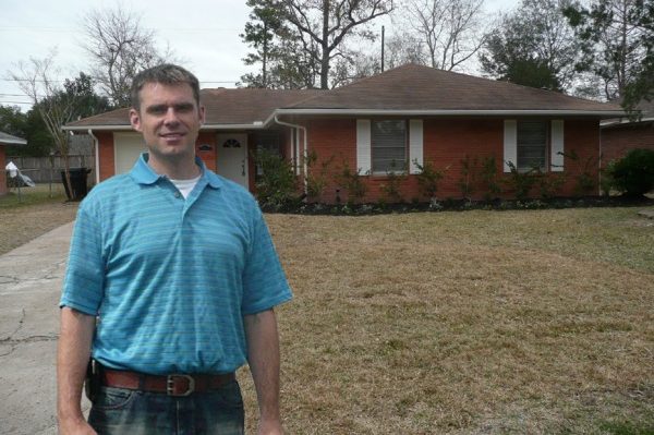 Titan Home Buyers owner standing in front of a house