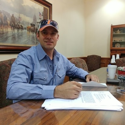 Titan Home Buyers owner signing documents